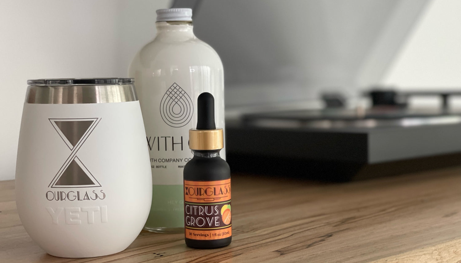 OURGLASS branded YETI tumbler and Citrus Grove delta 9 drops, perfect for showcasing delta 9 tincture and thc drops in a stylish setup.