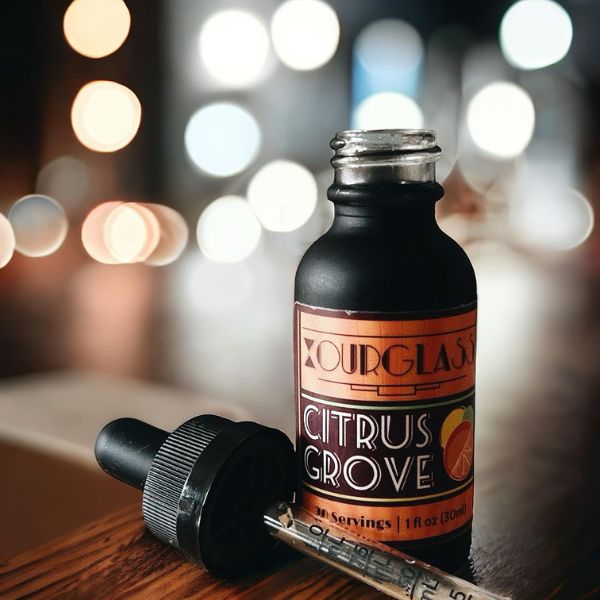 OURGLASS Delta-9 drops for drinks displayed with a dropper, perfect for creating Delta-9 beverages and thc tincture cocktails.