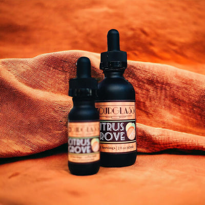 OURGLASS Delta-9 drops for drinks displayed on an orange fabric, ideal for creating Delta-9 beverages and thc tincture cocktails.