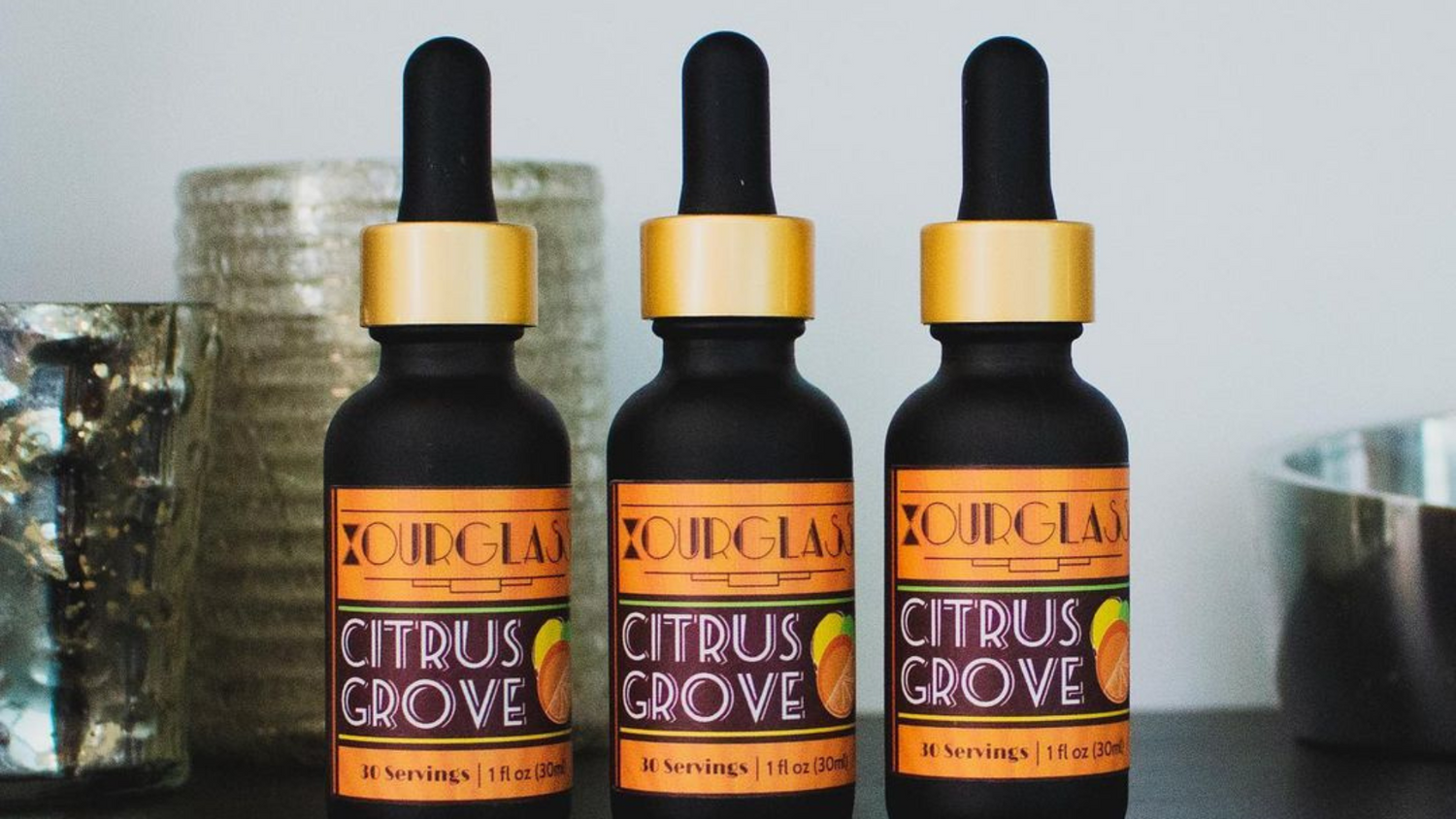 OURGLASS Citrus Grove delta 9 thc drink bottles lined up, showcasing the best thc drinks for a refined and enjoyable experience.